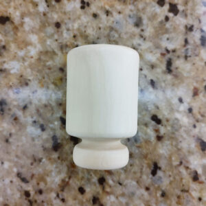 Quassia cups are typically made from the wood of the bitter ash tree (Simarouba amara), also known as quassia amara.